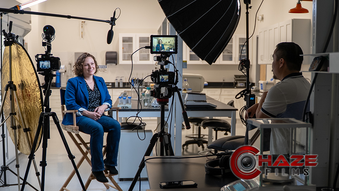 Boston video strategist filming interview in a lab for brand message video
